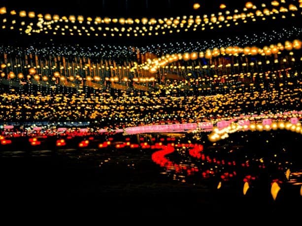 a night scene with a lot of lights hanging from the ceiling. Diwali home décor