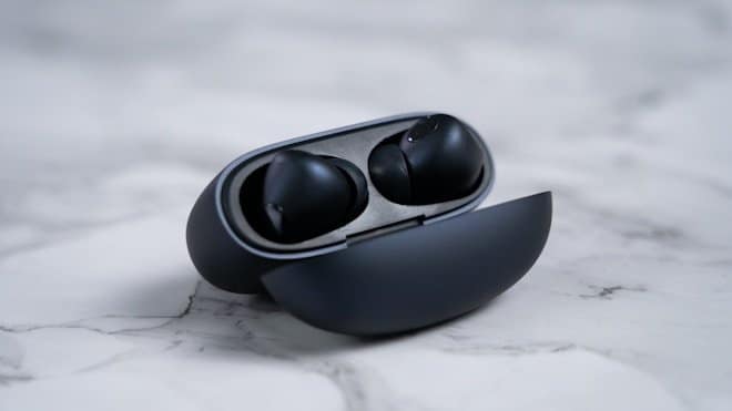 a black and white object. best ear buds