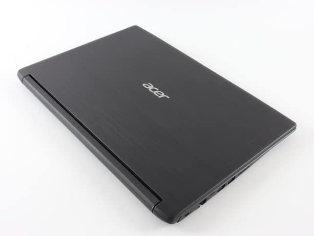 a laptop computer sitting on top of a white table